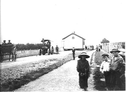 Moving building to Levin School, 1904