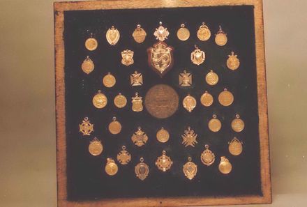Trophy - Medallions and Medals mounted together in display frame
