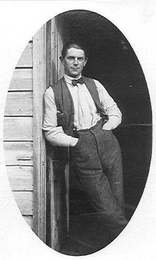 Unidentified Man Leaning in Doorway