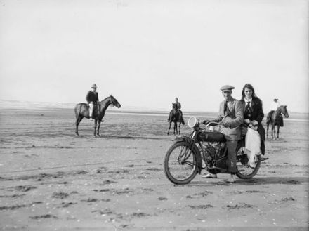 Dora Adkin and Ron Law on motorbike on Hokio Beach 1917