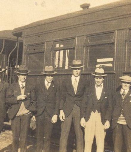 6 unidentified men standing by railway carrage, 1927