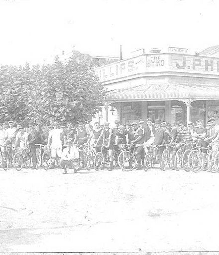 Group of Cyclists Outside Byko Shop