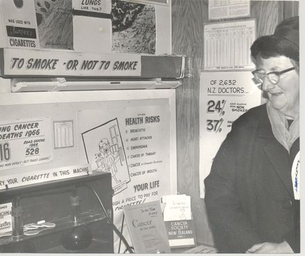 Woman (unidentified) volunteer with Anti-Smoking display - Resource cover image