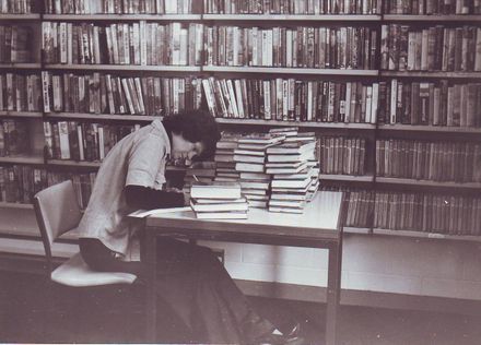 Pam Locke (assistant librarian) recording titles of new stock, mid 1970's
