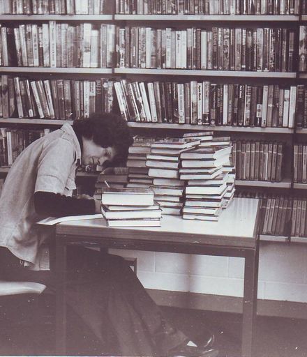 Pam Locke (assistant librarian) recording titles of new stock, mid 1970's