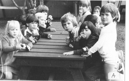 Children eating apples in picnic area at Summerland
