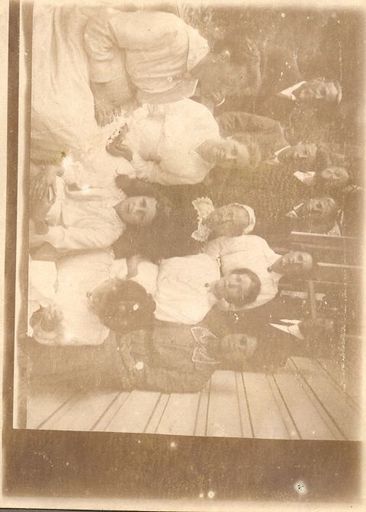 Group of men, women and children in formal clothing - Resource cover image
