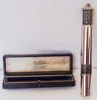 Otis King stainless steel calculator.