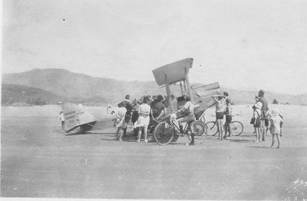 Bi-plane belonging to Hamilton Airways Ltd surrounded by people, 1927 or 1928