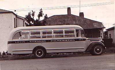 1938 Ford bus parked outside house, 1939