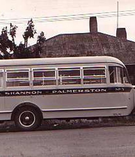 1938 Ford bus parked outside house, 1939