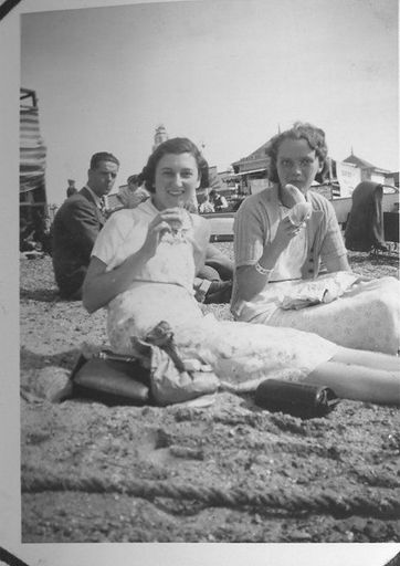 2 women on beach eating bananas. Westcliff - Resource cover image