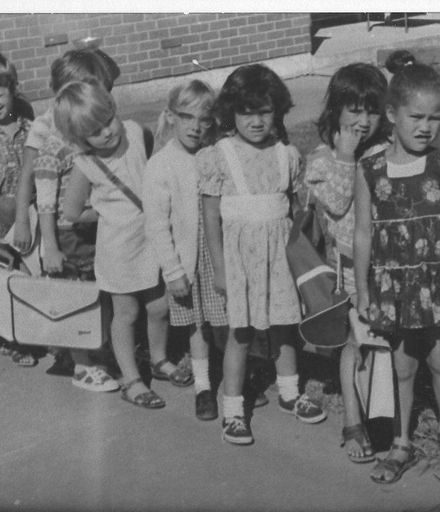 Children lined up with schoolbags for 'outing'
