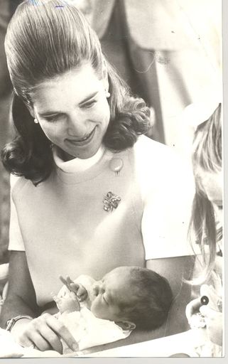 Princess Michael ? holding baby, England, 1969