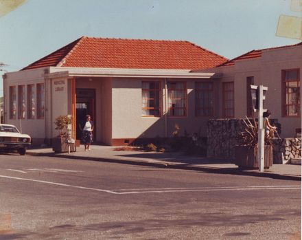 Exterior of Otaki Library with Mrs Noeline Papps (librarian) at entrance, 1981