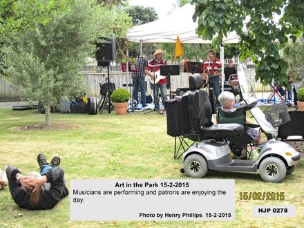 HJP 0278 Art in the Park 2015   Musicians are performing and patrons are enjoying the day. - Resource cover image
