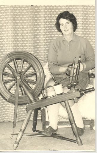 Woman (unidentified) gives spinning demonstration - Resource cover image