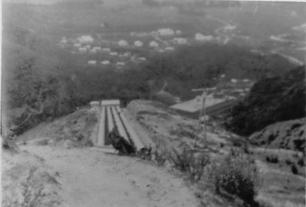 Looking down penstocks to powerhouse and Mangaore village, c.1920's (?)