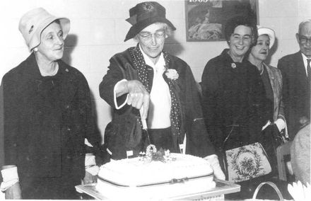 Cutting Red Cross cake