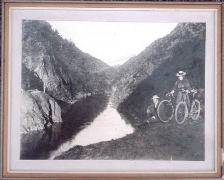 Unidentified man and woman with bicycles in Manawatu Gorge, (c.1900?)