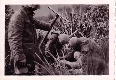 Three unidentified members of Manawatu Tramping Club assembling Memorial Trig, April 1937
