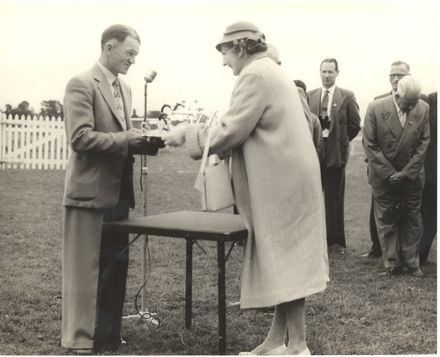 Marion Hannan being presented with award from Levin Racing Club.
