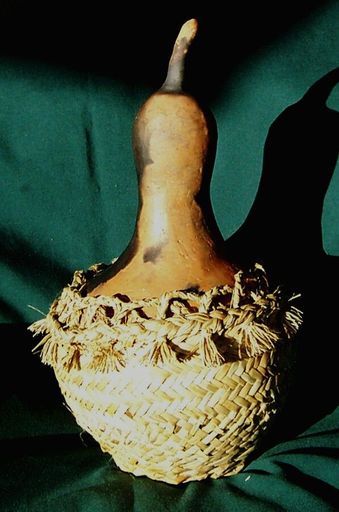 Pit-fired gourd in harakeke konae