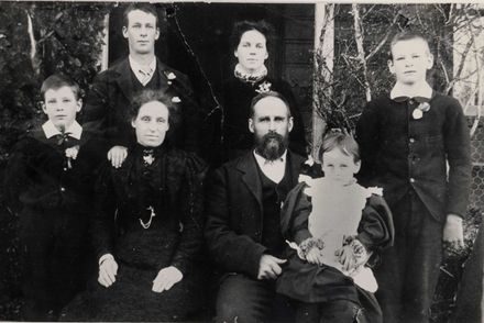 Family group (unidentified) 7 people outside house