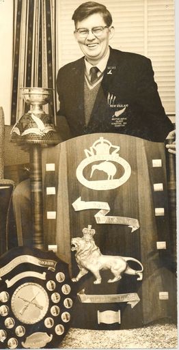 Mr Lacey with 3 trophies for smallbore rifle shooting - Resource cover image