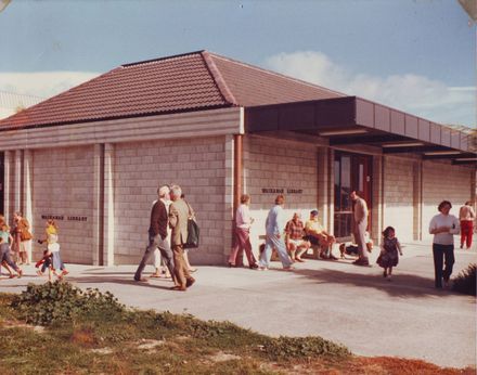 Exterior of Waikanae Library with groups of unidentified people, 1981