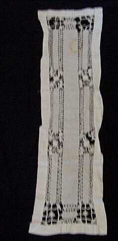 Runner with 4 long strips of embroidery.