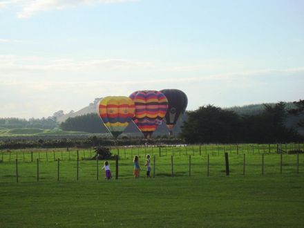 2011 Balloons - Friday afternoon 3 balloons over Lake Horowhenua with onlookers Levin