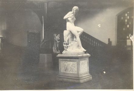 White statue of naked woman beside staircase possibly in the Government Gardens Bath House Rotorua