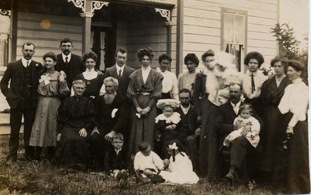 Large family gathering (22 people) outside house