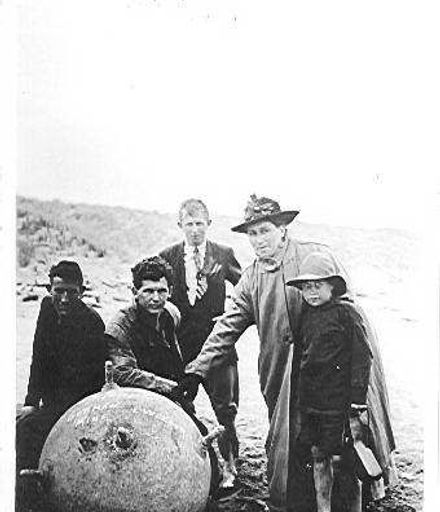 Unidentified group with washed up mine