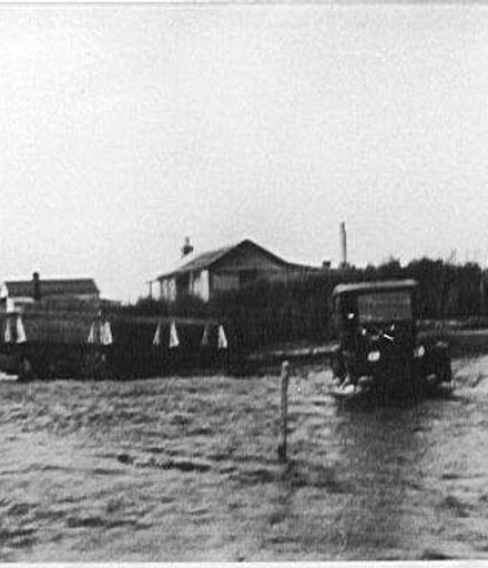 Car fording across Hokio Stream, 1920s