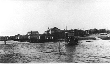 Car fording across Hokio Stream, 1920s