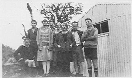 Group Beside Corrugated Iron Building