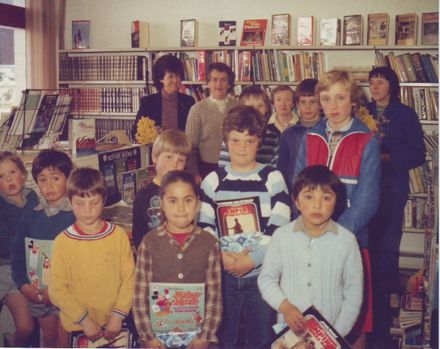 "Storytime" prizewinners (unidentified) with prizes at Shannon Library, 1980's