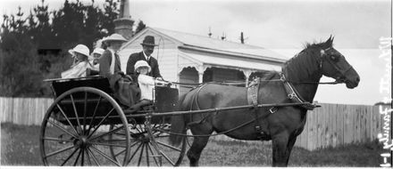Family in a cart and horse