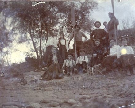 Group of people on a river bank?