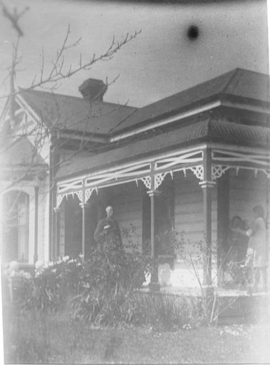 Harry Blackburn and others on verandah