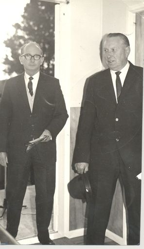 2 men (unidentified) standing in doorway
