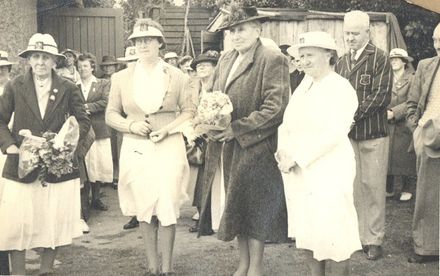 4 women, 2 with posies and 1 probably Mrs Lett, in a group.