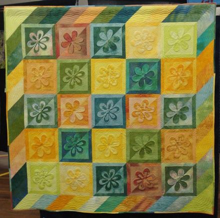Yellow and green quilt.