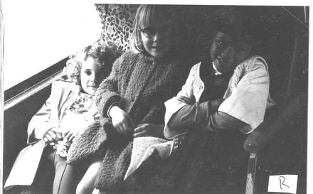 Children seated on bus