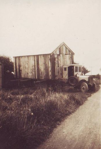 Similar view of shed (wooden garage) on truck for moving
