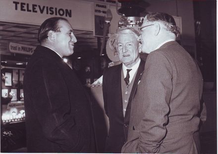 3 men near Textiles display, Electricity Exhibition 1972