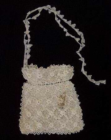 Crocheted bag with lace drawstring.