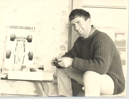 Man (unidentified) with model racing car kitset